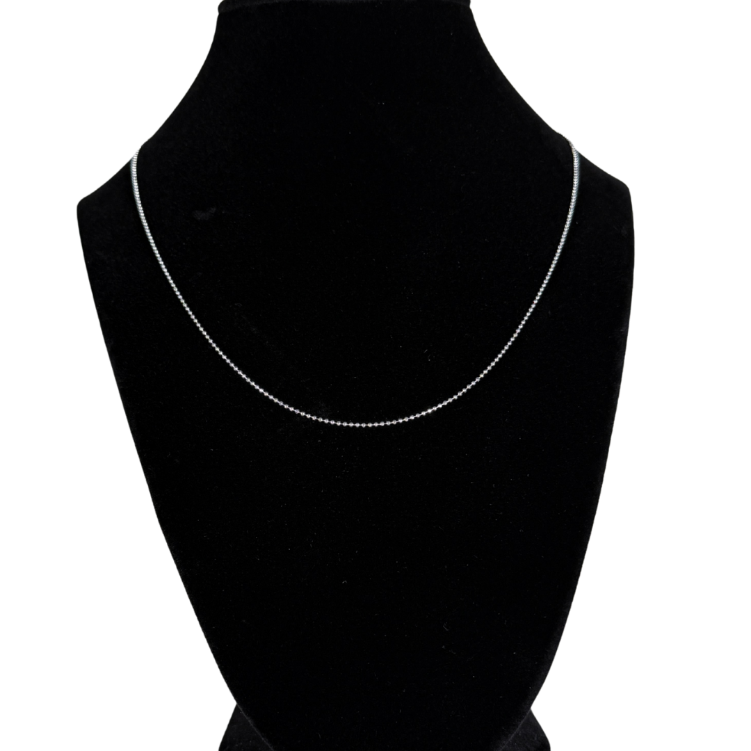 1mm sterling silver bead chain necklace, 18 inch, displayed on black velvet stand