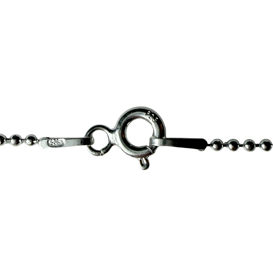 925 stamp on sterling silver ball chain clasp and connector tab, close up.